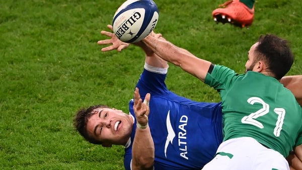 Antoine Dupont (L) is tackled by Ireland's scrum-half Jamison Gibson-Park (R)