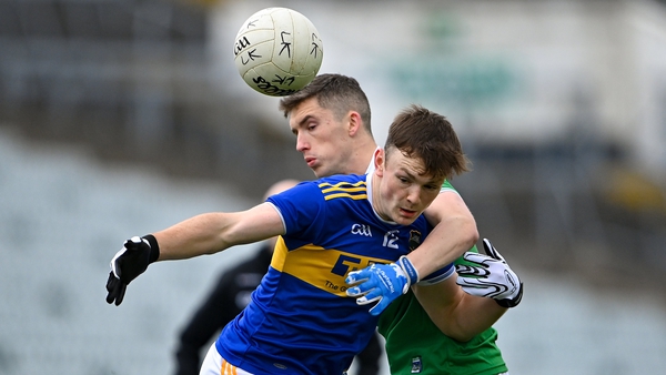 Emmet Moloney of Tipperary in action against Seán McSweeney of Limerick
