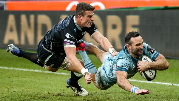 Dave Kearney dives to score Leinster's second try despite the attentions of Scott Williams of Ospreys