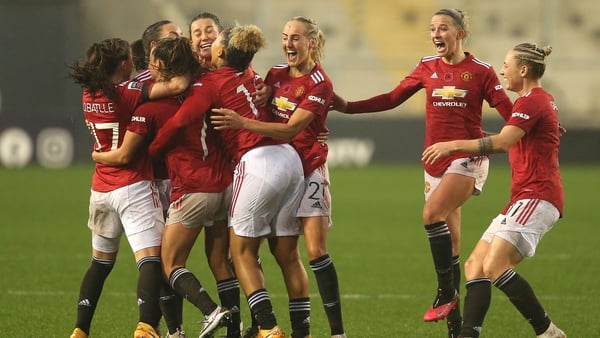 Toone of Manchester United celebrates with teammates
