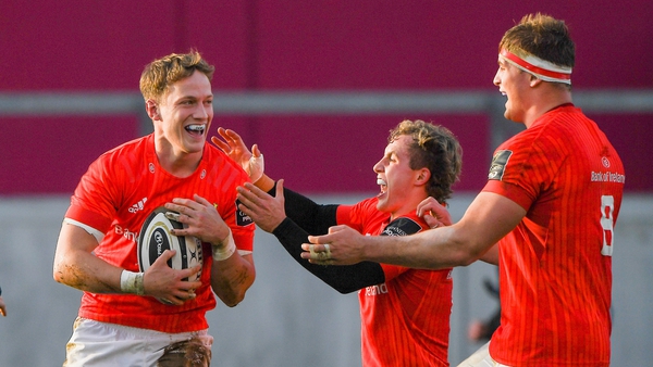 Mike Haley celebrates with team-mates Craig Casey and Gavin Coombes after scoring the second Munster try