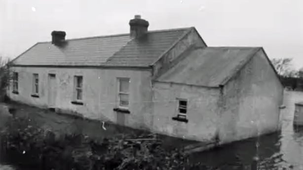 House surrounded by flood waters (1965)