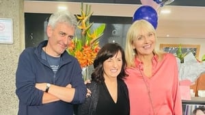 David McCullagh and Miriam O'Callaghan pose with their colleague (C) on her final day at work