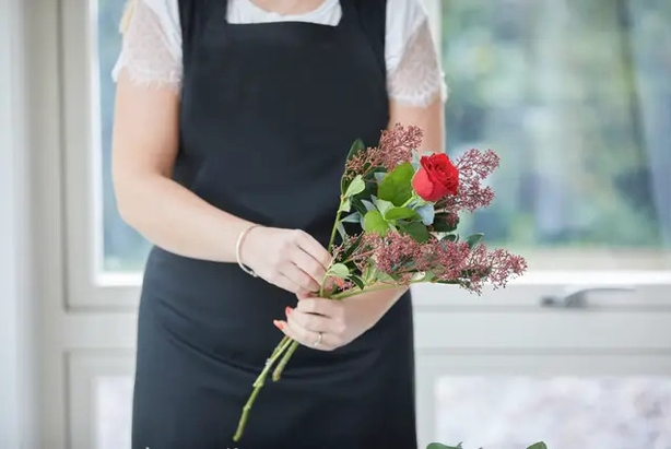 Start with foliage stems alternating with flowers (Interflora/PA)