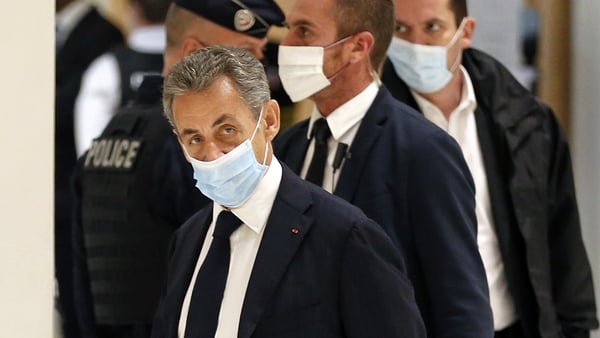 Former French president Nicolas Sarkozy arrives at court for his trial on corruption charges