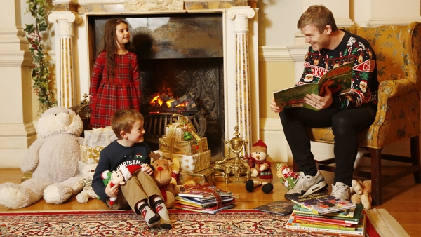 Gordon D'Arcy reading to Jack Siron (age 4) and Ava Murphy (age 5) in Farmleigh House where some Dublin Book Festival Christmas Bedtime Stories were filmed