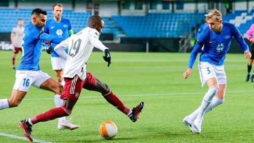 Nicolas Pepe (C) vies for the ball with Molde's Etzaz Hussein (L) a