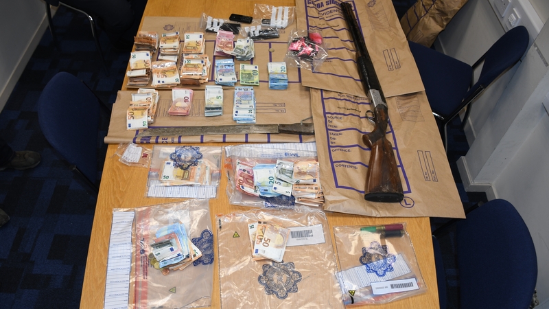 Drugs,
cash and a shotgun were found during searches in Waterford
city
