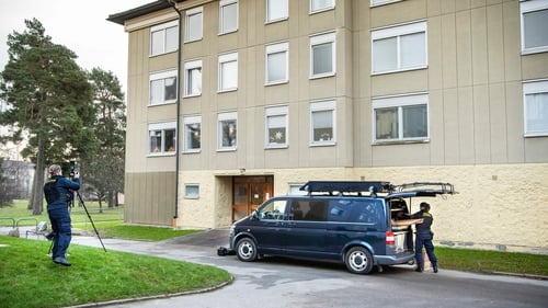 A police forensic team outside the apartment building in Haninge, Stockholm