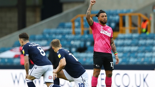Colin Kazim-Richards of Derby County raises his right fist before the clash at The Den