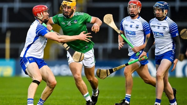 Tom Morrissey of Limerick is tackled by Tadhg De Búrca of Waterford in the Munster hurling final