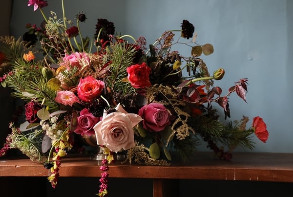 There's nothing that creates a festive table better than a glorious flower and foliage decoration.