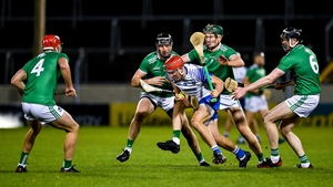 Jack Prendergast of Waterford tries to escape Limerick players (from L) Barry Nash, Diarmaid Byrnes, William O'Donoghue and Declan Hannon during the Munster final