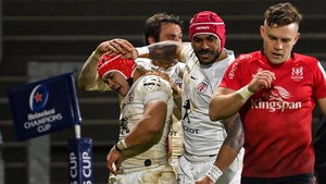 Cheslin Kolbe, left, is congratulated by Toulouse team-mates after scoring his side's fourth try