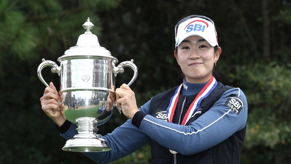 A Lim Kim poses for a photo with the trophy