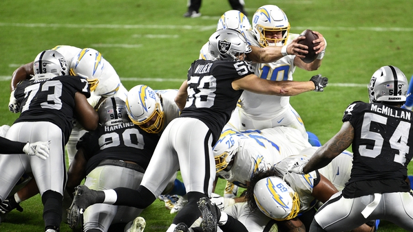 Quarterback Justin Herbert #10 of the Los Angeles Chargers dives into the end zone