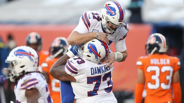 Josh Allen #17 and Dion Dawkins #73 of the Buffalo Bills celebrate a touchdown