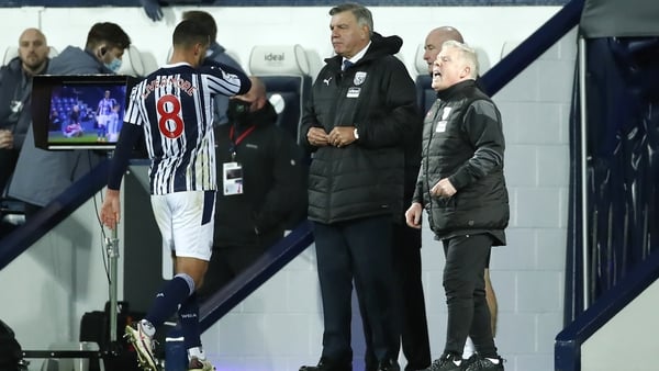 Jake Livermore leaves the field of play past a stone-faced Sam Allardyce
