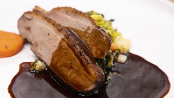 Neven's breast of duck with sweet potato fondants, creamed cabbage, honey & ginger sauce