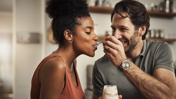 happy couple eating dessert