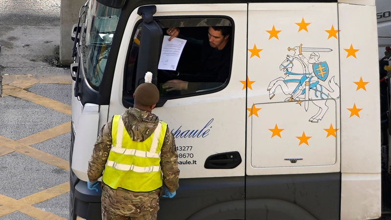 A lorry driver shows his credentials as he enters the Port of Dover