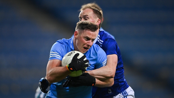 McMahon is tackled by Martin Reilly of Cavan during the All-Ireland semi-final in December