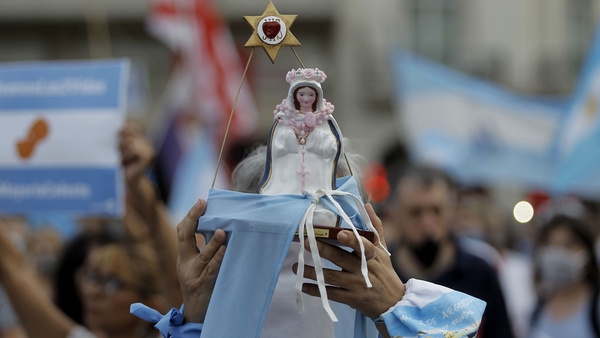Anti-abortion supporters wearing light blue scarves as they protest in Argentina