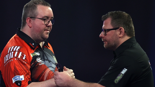 Stephen Bunting (left) came from two sets down to beat James Wade
