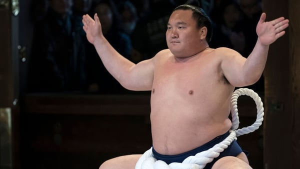 Hakuho performs a kata during the ring-entering ceremony at the Meiji Jingu Shrine in January last year