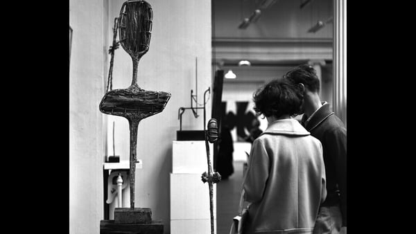 Gallery visitors examine a Hilary Heron sculpture at the Living Art Exhibition at the National College of Art, Dublin in 1963. Photo: RTÉ Stills Library