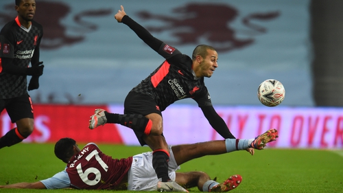 Thiago Alcantara is tackled by Aston Villa's Arjan Raikhy