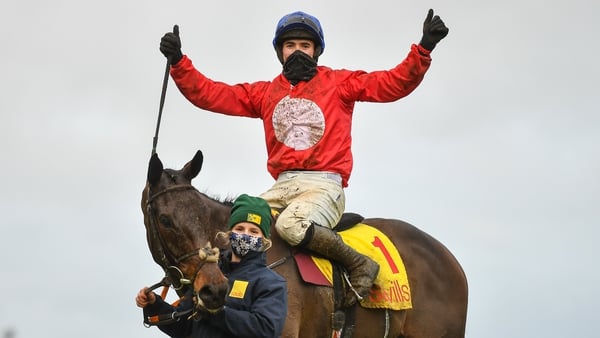 Darragh O'Keeffe celebrates after riding A Plus Tard to victory in the Savills Steeplechase at the Leopardstown Christmas Festival