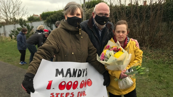 Mandy with her mother Frieda and father Fergus after completing her one million step challenge in Hudson Road Park in Dublin