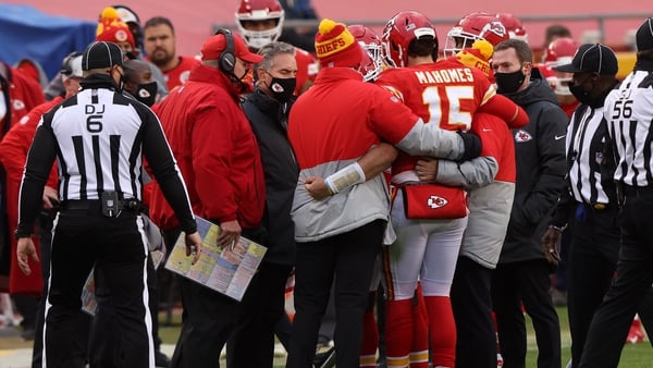 Patrick Mahomes is assisted off the field after an injury from a sack