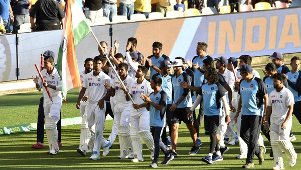 India players and staff celebrate their victory