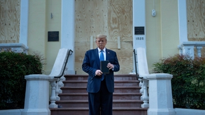 Donald Trump holds a Bible while visiting St John's Church across from the White House in June 2020. He made his way to the church after the area was cleared of people protesting the death of George Floyd
