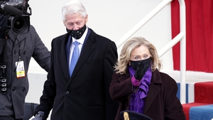 Former President Bill Clinton arrives with former Secretary of State Hillary Clinton