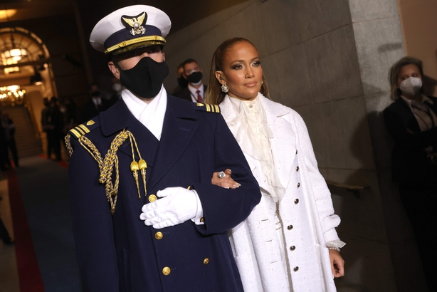 Jennifer Lopez is escorted to the inauguration of US President-elect Joe Biden on the West Front of the US Capitol on January 20, 2021 in Washington DC.