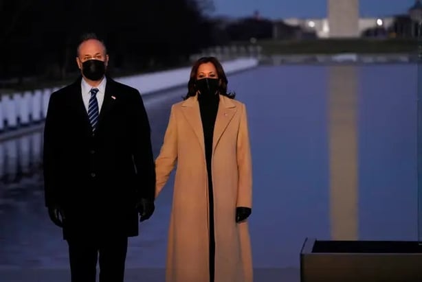 Kamala Harris with her husband Doug Emhoff during the Covid-19 memorial at the Lincoln Memorial Reflecting Pool (Evan Vucci/AP)