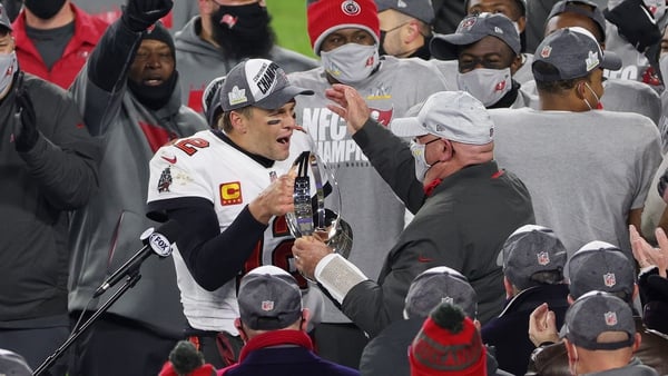 Tom Brady celebrates with Bucs coach Bruce Arians after the road team won the George Halas Trophy