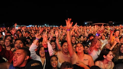Large crowds enjoy an outdoor concert in Hastings, New Zealand, on Saturday night