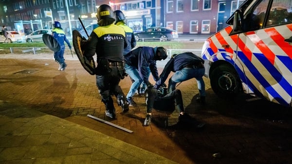 Riot police clashed with groups of protesters in several cities, including here in Rotterdam