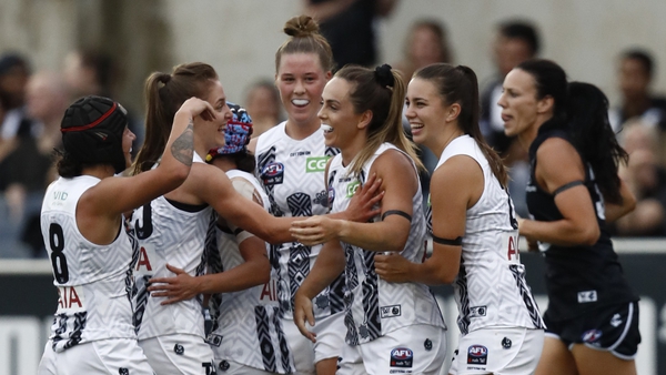 Aishling Sheridan is mobbed after scoring Collingwood's first goal