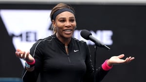 Serena Williams (R) of the US speaks to crowd after her victory against Australia's Daria Gavrilova