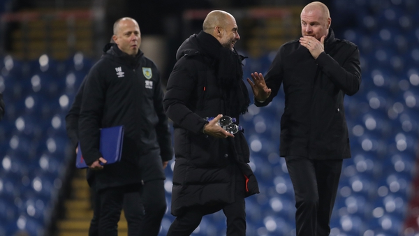 Pep Guardiola and Sean Dyche share a moment after the game at Turf Moor