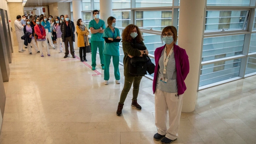 Health care workers waiting for vaccination last month at Gregorio Maranon Hospital in Madrid