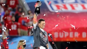 Tom Brady hoists the Vince Lombari trophy as he secured his seventh Super Bowl victory