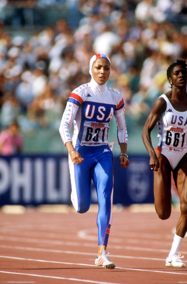 Florence Griffith-Joyner racing in a hooded outfit in 1987 (S&G/S&G and Barratts/EMPICS Sport/PA)