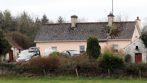 The bodies were removed from the house in Cloverhill yesterday
