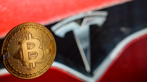 Bitcoin seeing big gains after electric carmaker Tesla said it bought $1.5 billion in bitcoin and would accept the currency as payment